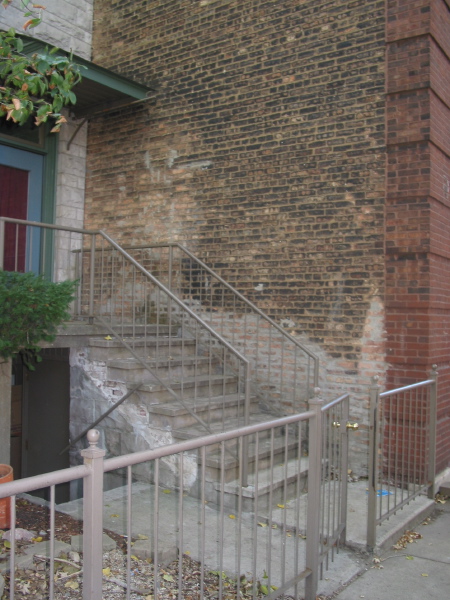 Western-most door for 957 W. Montana with east wall of 961 W. Montana
